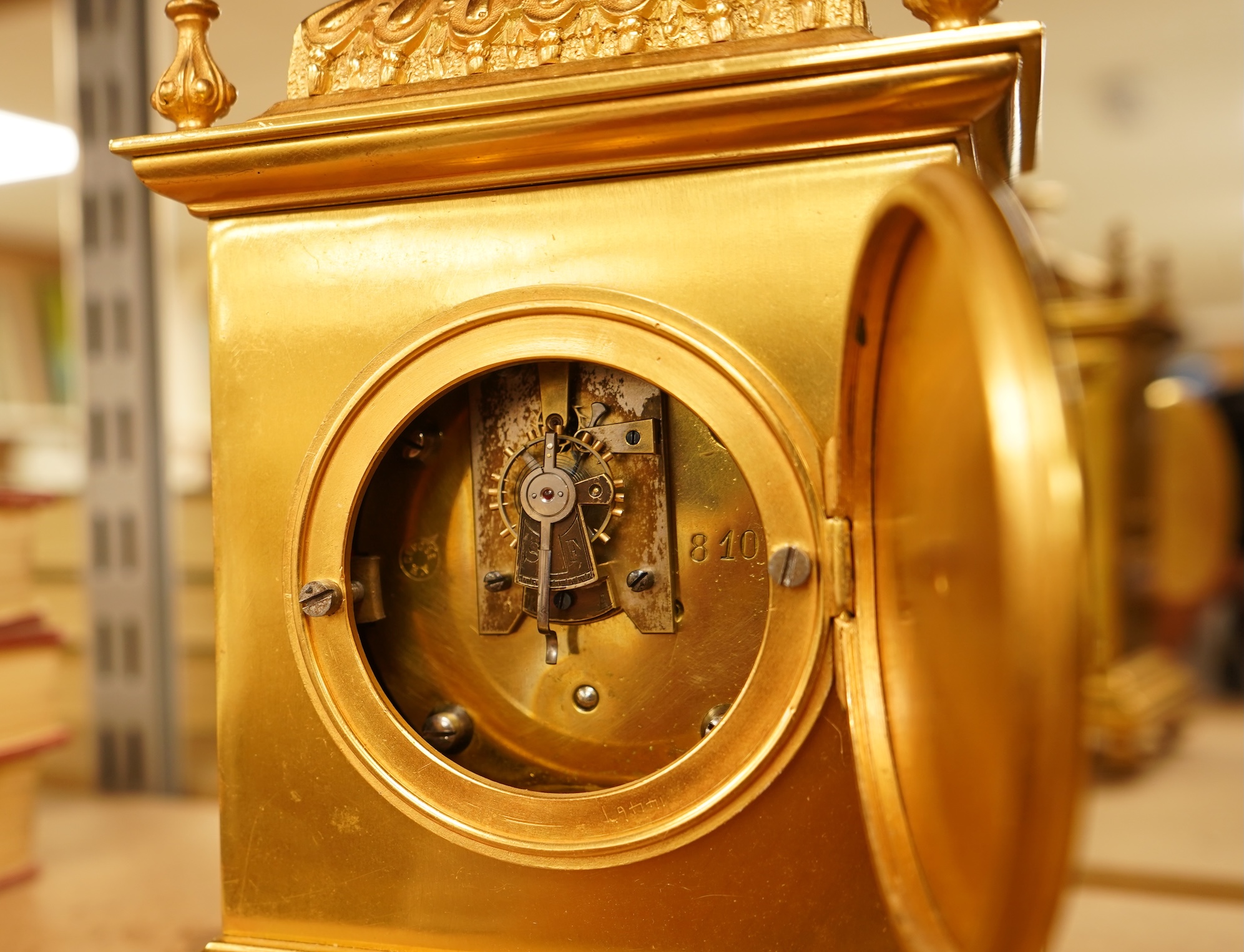 A French gilt brass timepiece with key, 19cm high
